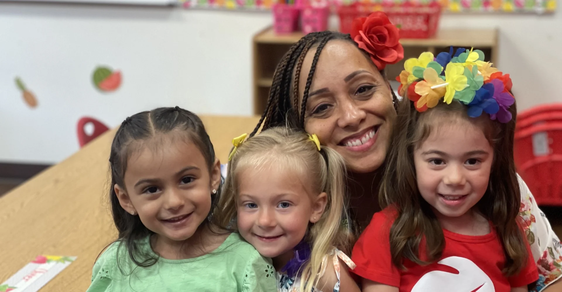 three students and teacher smiling