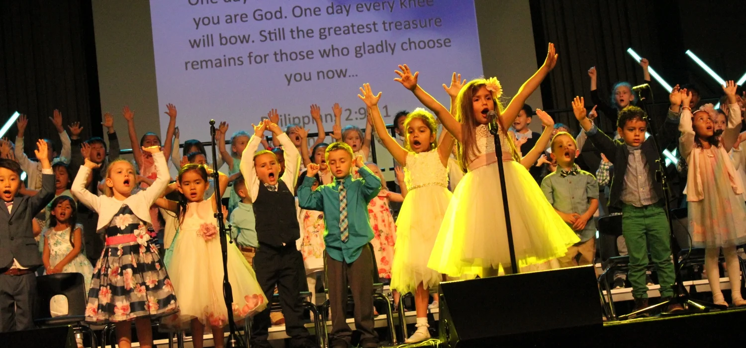 students performing on stage